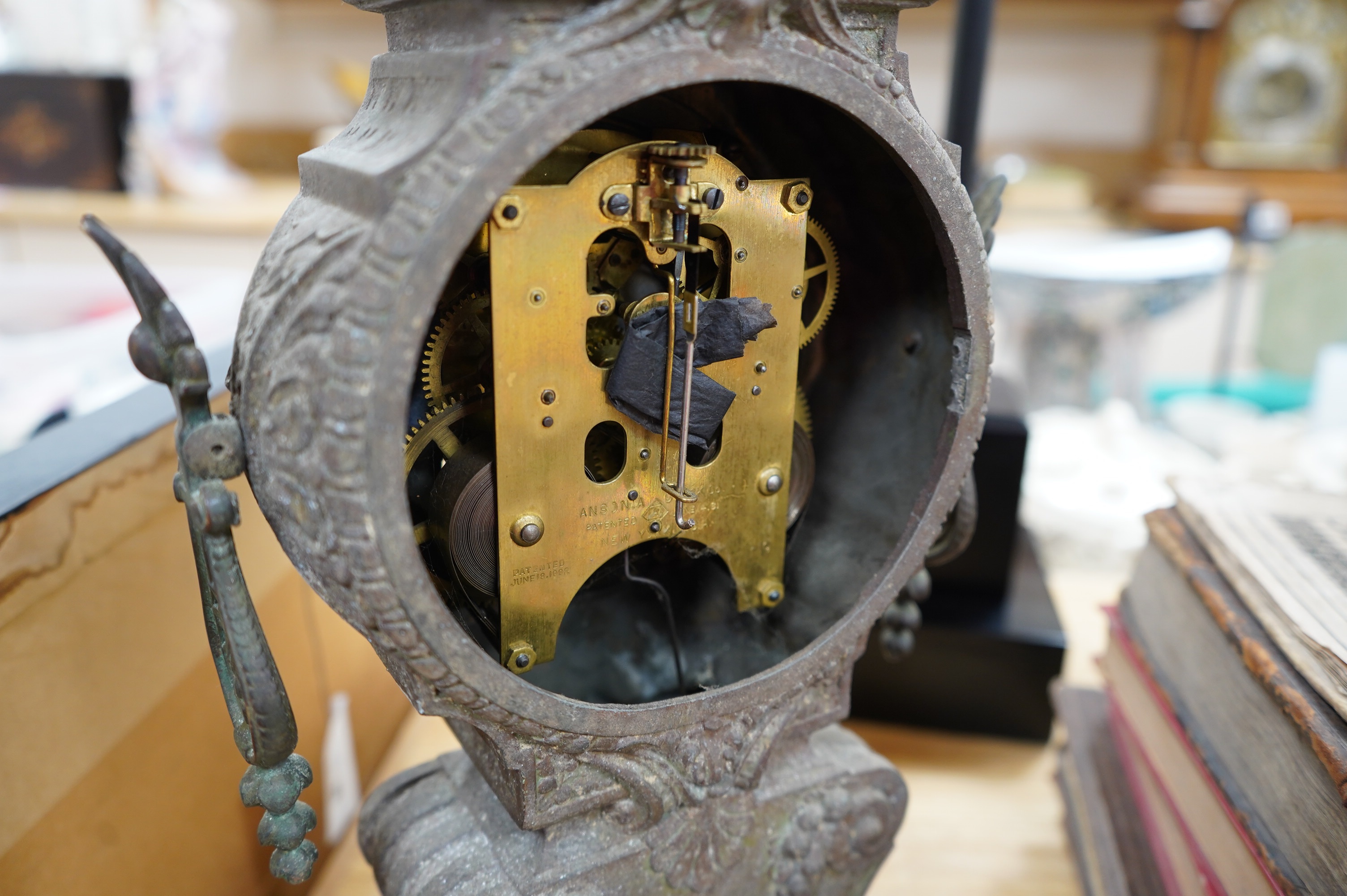 A spelter clock with enamel Arabic dial, 47cm high. Condition - poor to fair, untested